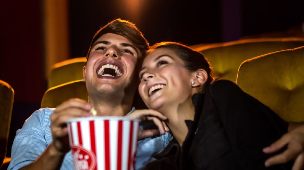 Teacher discounts couple laughing cinema